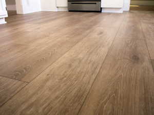 View of brand  new waterproof LVP flooring recently installed in the kitchen of White Door unit 2