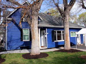 View of side yard.  White door is 3 bed unit.  Separate entrance and NOT connected to Red door 1 bed front unit.
