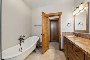 Bathroom with a freestanding bath and vanity