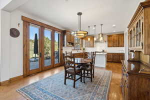 Dining space with french doors, recessed lighting, baseboards, visible vents, and hardwood / wood-style flooring