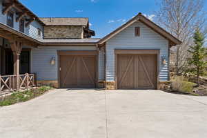 Garage featuring concrete driveway