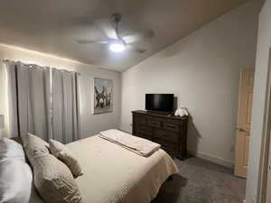 Bedroom featuring carpet flooring, ceiling fan, baseboards, and lofted ceiling