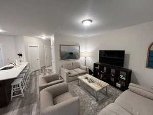 Living room with baseboards and wood finished floors