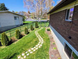 View of yard with a fenced backyard