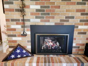 Room details featuring a glass covered fireplace