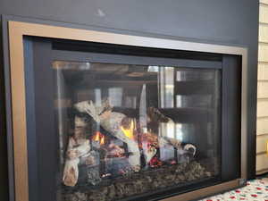 Interior details featuring a glass covered fireplace