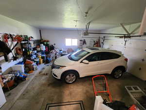 Garage featuring a garage door opener