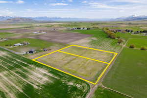 Birds eye view of property with a mountain view and a rural view