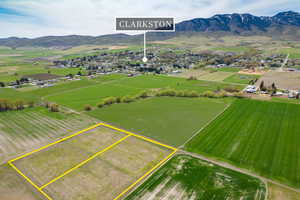 Birds eye view of property with a rural view and a mountain view