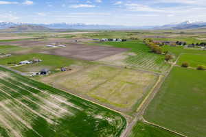 Birds eye view of property with a mountain view and a rural view