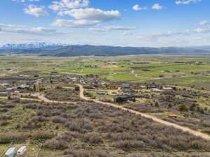 Birds eye view of property with a rural view and a mountain view