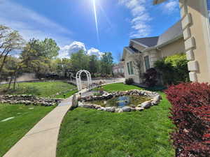 View of yard with a small pond