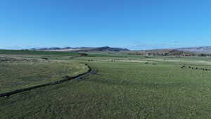 View of mountain background featuring rural landscape