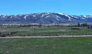 Property view of mountains with a rural view