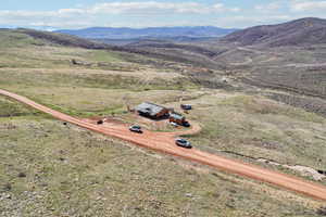 Birds eye view of property featuring a mountain view and a rural view