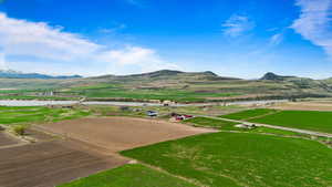 View of mountain feature featuring a water view and a rural view