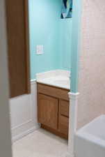 Bathroom with vanity and tile patterned flooring