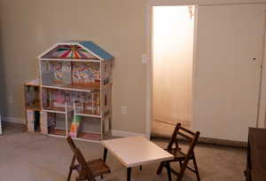Dining space with baseboards and carpet