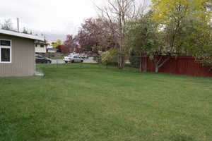 View of yard with fence