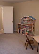 Home office with baseboards and carpet
