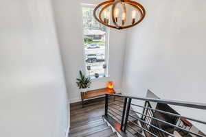 Staircase with an inviting chandelier,