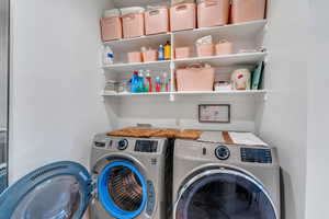 Master Laundry area with washing machine and dryer