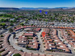 Birds eye view of property with a mountain view and a residential view