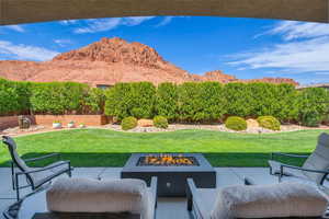 View of patio featuring a mountain view and a fire pit