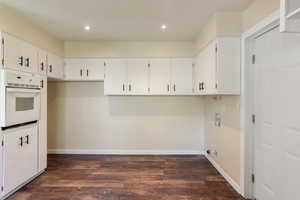 Kitchen with laundry hook-ups, recessed lighting, baseboards, and dark wood-style floors
