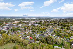 Birds eye view of property with a mountain view