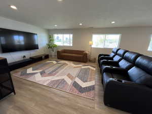 Living room featuring recessed lighting and wood finished floors