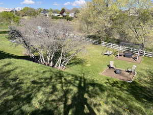 View of yard featuring fence