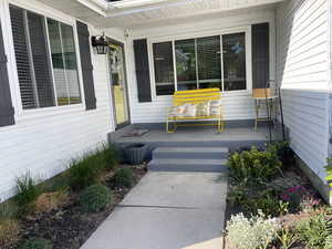 Entrance to property with a porch