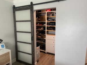 Walk in closet in primary bedroom