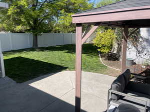 View of yard featuring a fenced backyard and a patio area