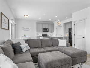 The open floor plan is perfect for entertaining.  You will love the wood look flooring, neutral decor and high ceilings.