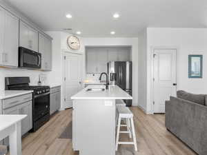 Spacious island, efficient corner pantry, quartz countertops and an upgraded gas range.