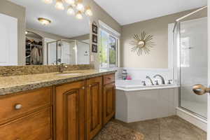 Ample counter space, granite countertops, oversized soaking tub and a separate shower