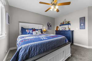 One of three main level bedrooms with neutral fresh paint and newer carpet