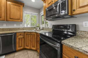 Stainless steel appliances and custom cabinets