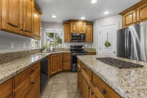 Plenty of counter space, efficient corner pantry and custom wood cabinets
