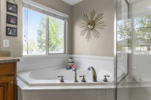Generous garden soaking tub in the primary spa style suite