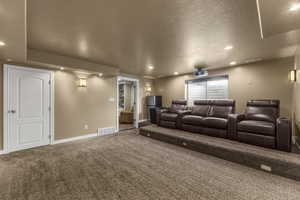 Spacious theater room with stadium seating