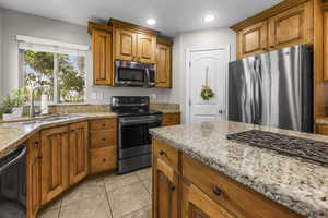 Smooth top range, corner sink with two windows and a center island