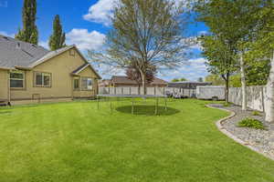 Lush landscaping, full fencing, gates on both sides, landscape curbing and mature trees.