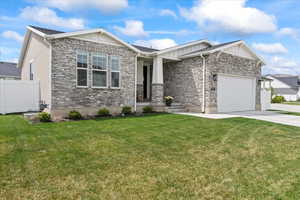 Craftstman exterior featuring brick, board and batten, and stucco finishes.