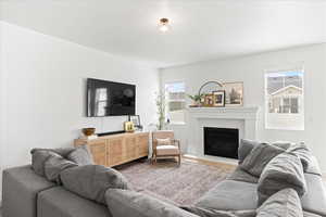 Living room featuring TV and Fireplace. This living room gives you ample ways to lay out your furniture.