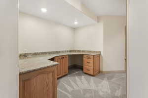 Unfurnished office with light colored carpet, recessed lighting, and baseboards