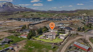 Aerial view featuring a residential view and a mountain view