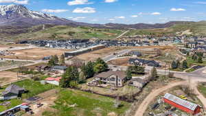 Birds eye view of property featuring a mountain view and a residential view